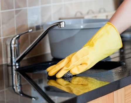 Professional house cleaning tools arranged for a home cleaning routine