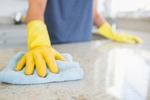 Deep cleaning a fabric sofa in a living room setting