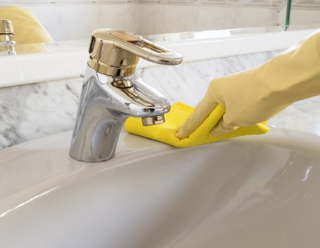 Routine domestic cleaning in a bedroom with fresh linens